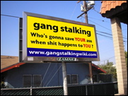 Gang stalking billboard by Cliff Huylebroeck: gang stalking