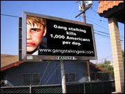 Gang stalking billboard by Cliff Huylebroeck: Gang stalking kills 1,000 Americans per day