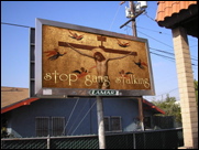 Gang stalking billboard by Cliff Huylebroeck: Jesus says stop gang stalking